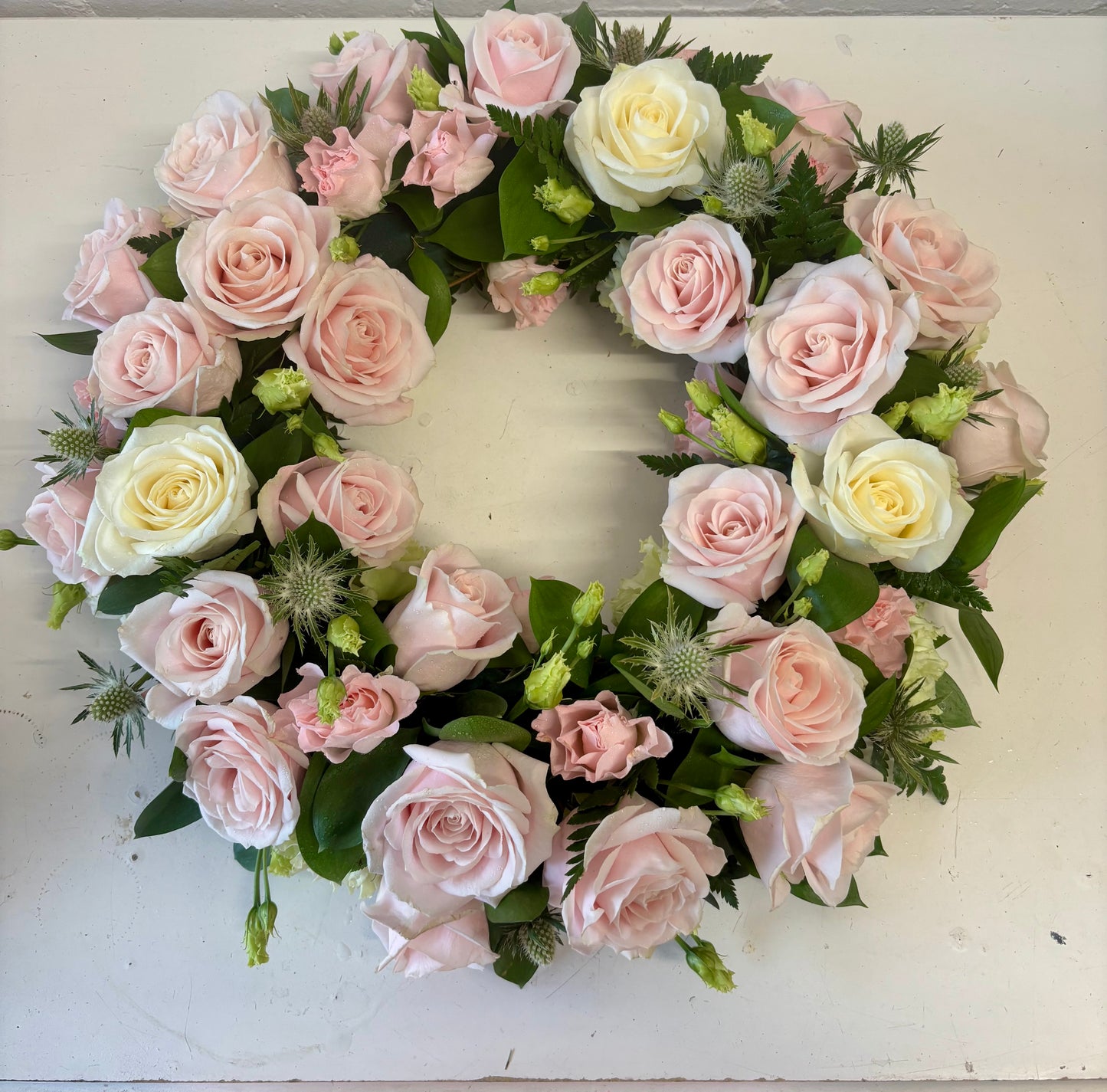 Wreath Green base with pink rose